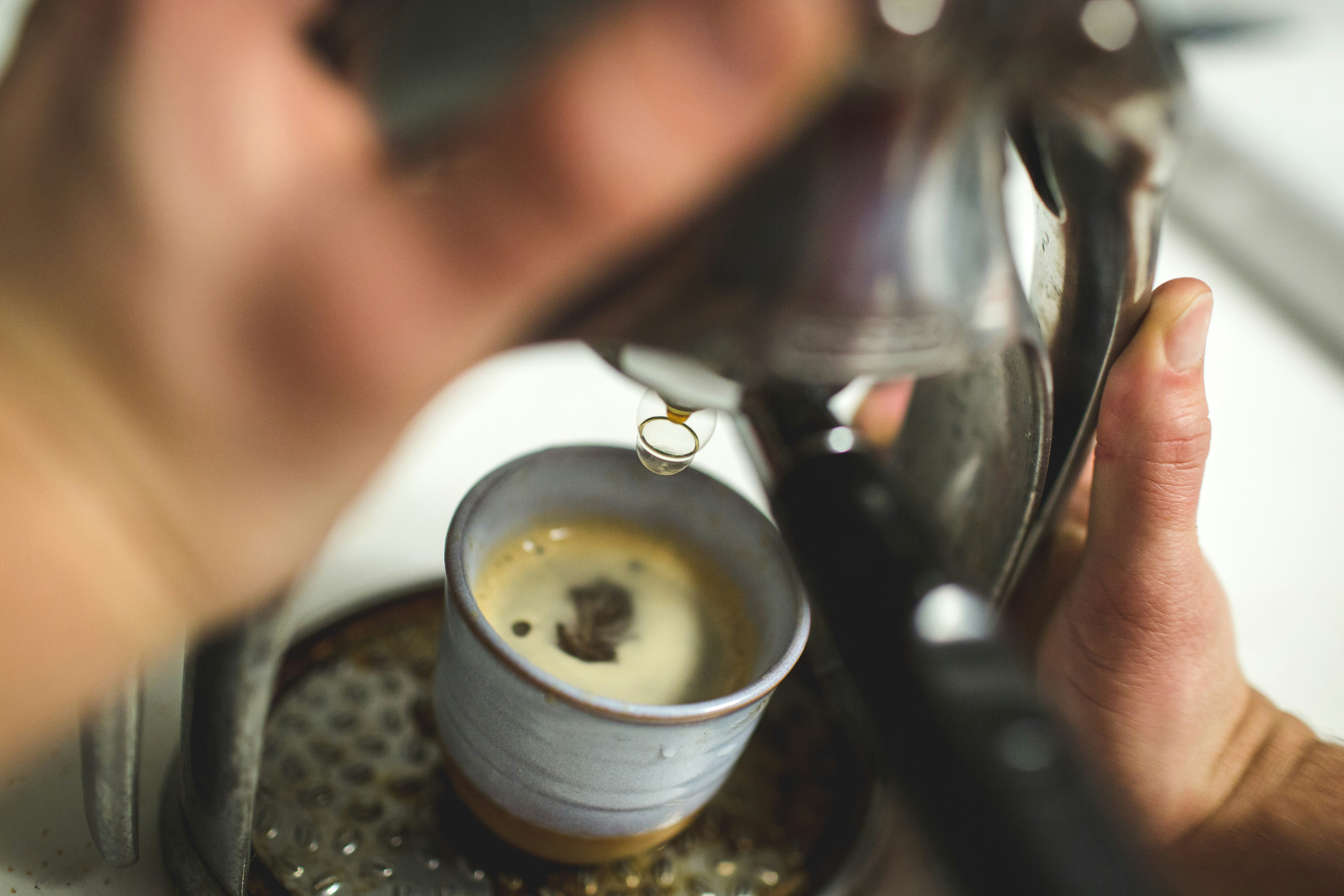 selective focus photography of coffee mug